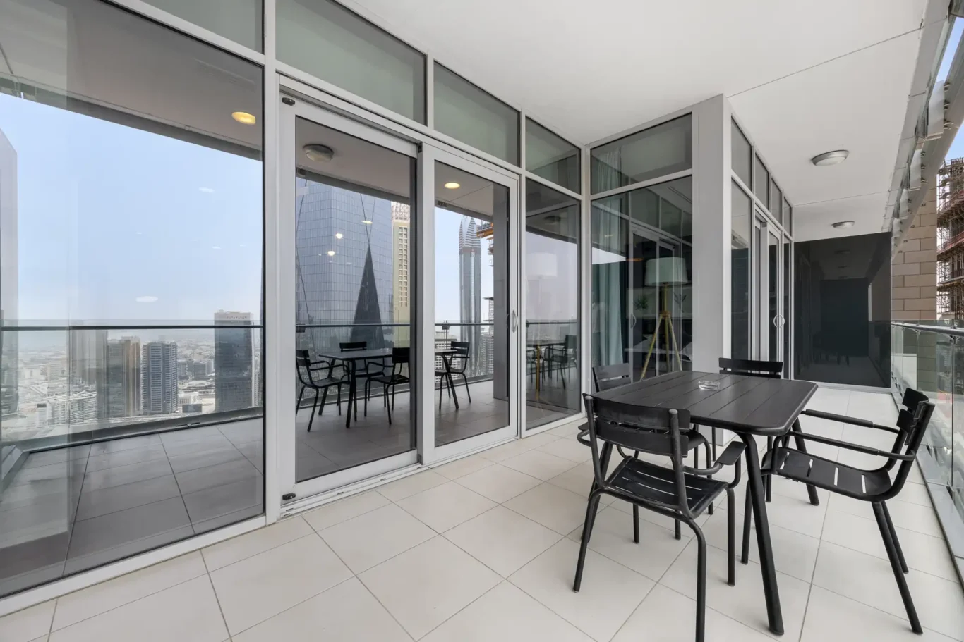 Balcony dining set in a Your Stay Apartments one-bedroom at Burj Daman, DIFC, Dubai.