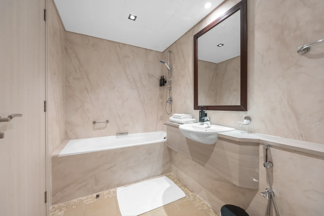 Bathroom vanity and mirror in a Your Stay Apartments one-bedroom at Sky Gardens, DIFC, Dubai.