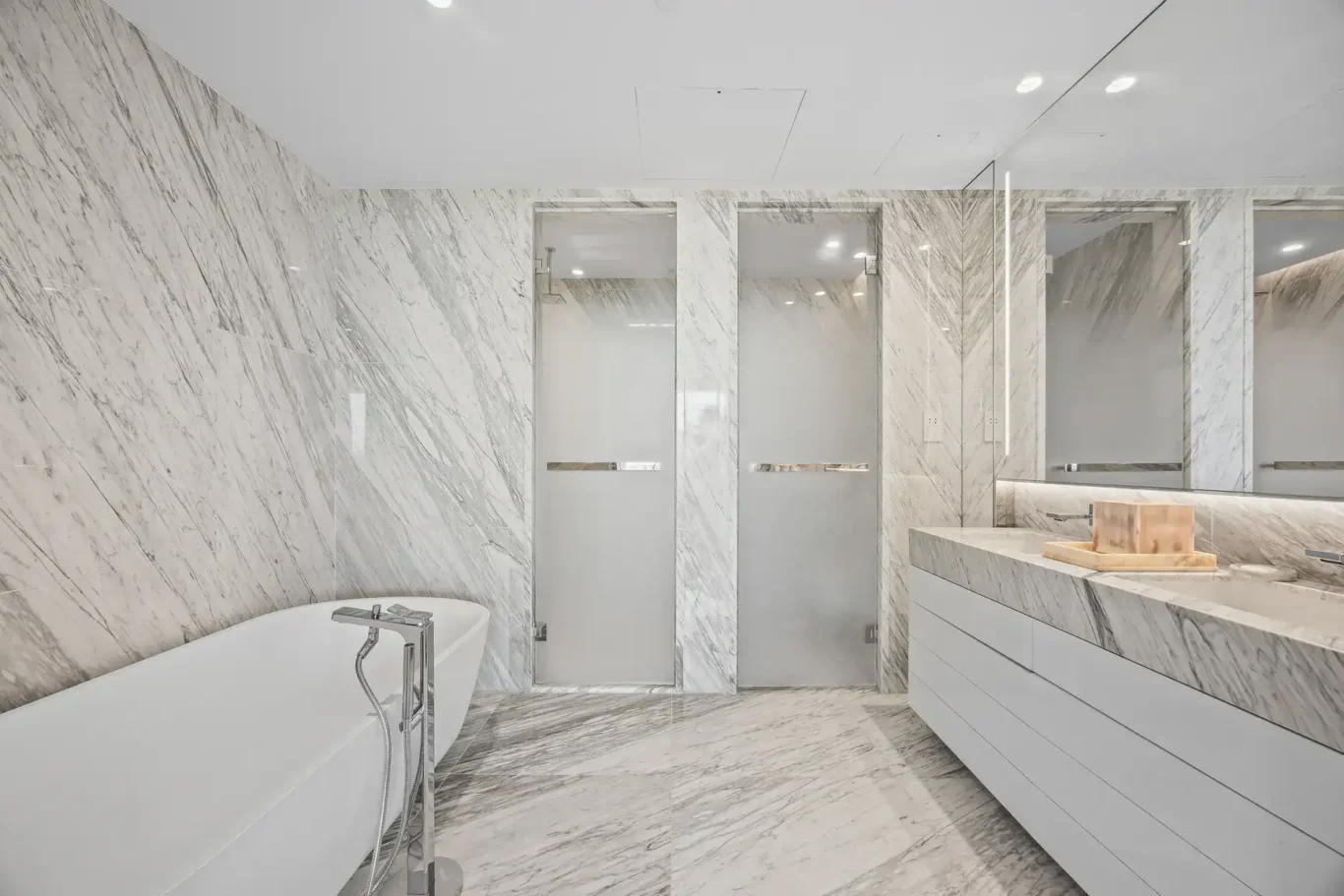 Marble master bathroom with double vanity in a furnished three-bedroom residence at Atlantis The Royal, Palm Jumeirah, photographed for Apex Homes Real Estate.