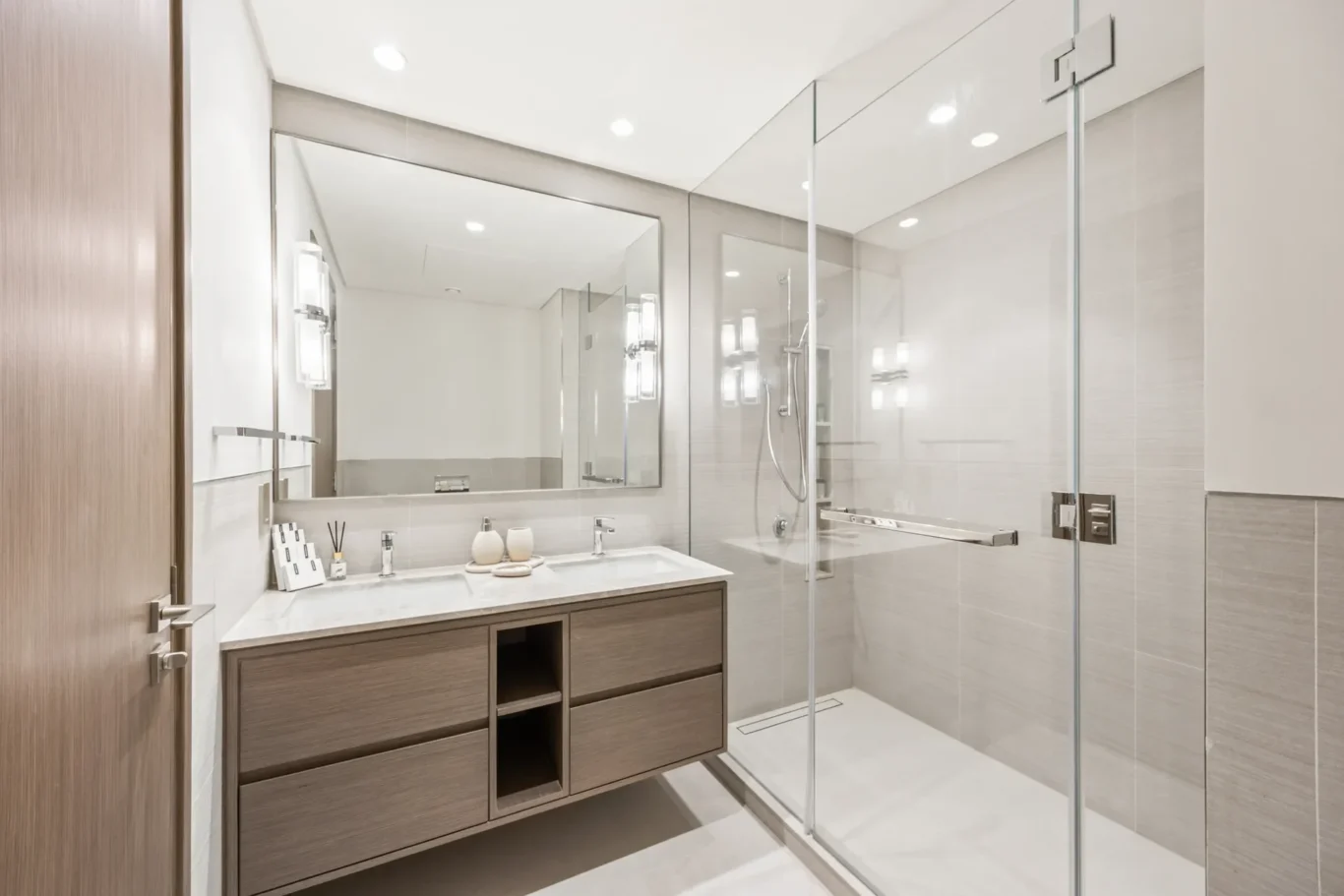 Second bathroom vanity and shower in a two-bedroom StayComfy Holiday Homes apartment at Grande Signature, Downtown Dubai.