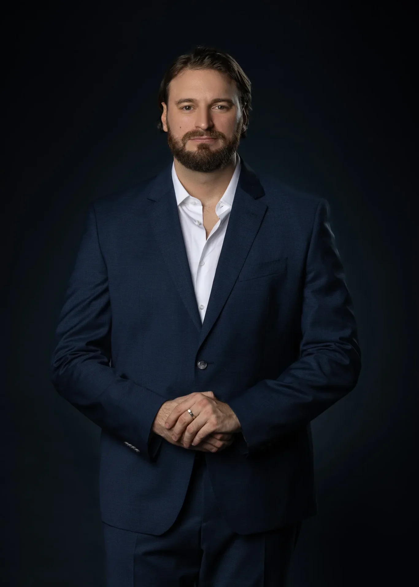 Standing business portrait on a dark backdrop. Business portrait from an AI digital twin photoshoot at the MRPS studio in Dubai.