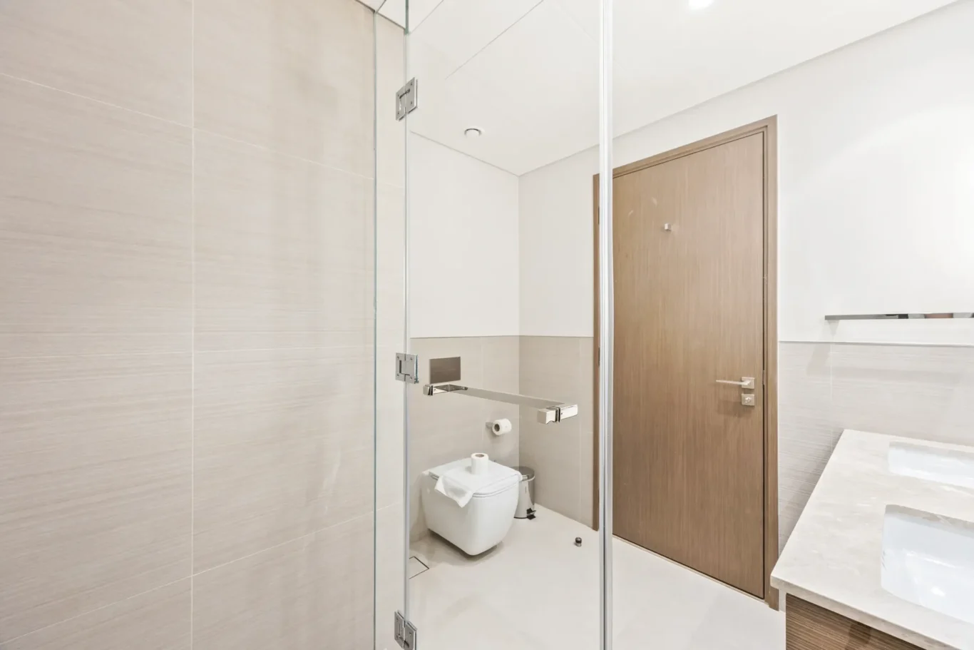 Walk in shower and WC in a two-bedroom StayComfy Holiday Homes apartment at Grande Signature, Downtown Dubai.