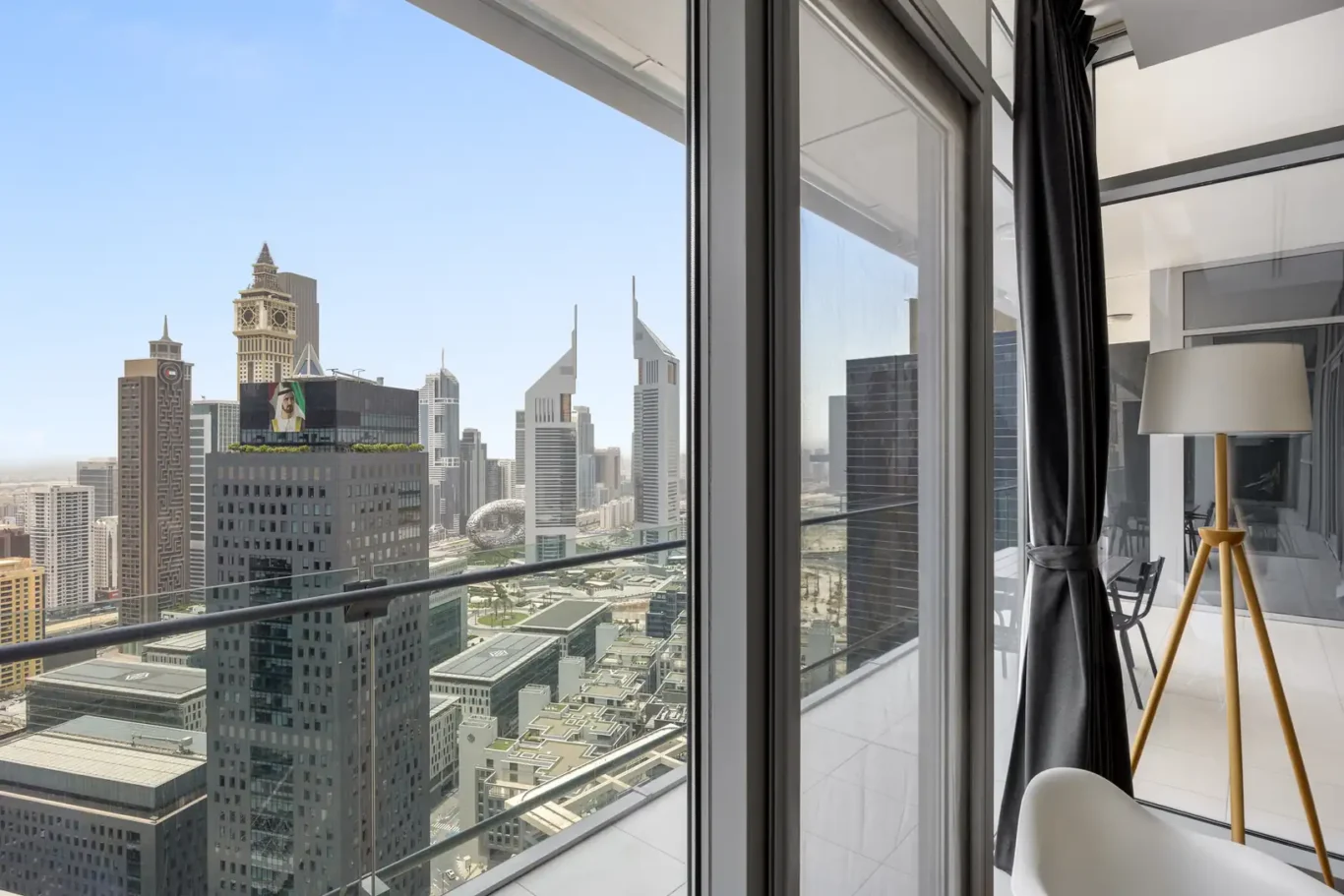 DIFC towers seen from the bedroom in a Your Stay Apartments one-bedroom at Burj Daman, DIFC, Dubai.