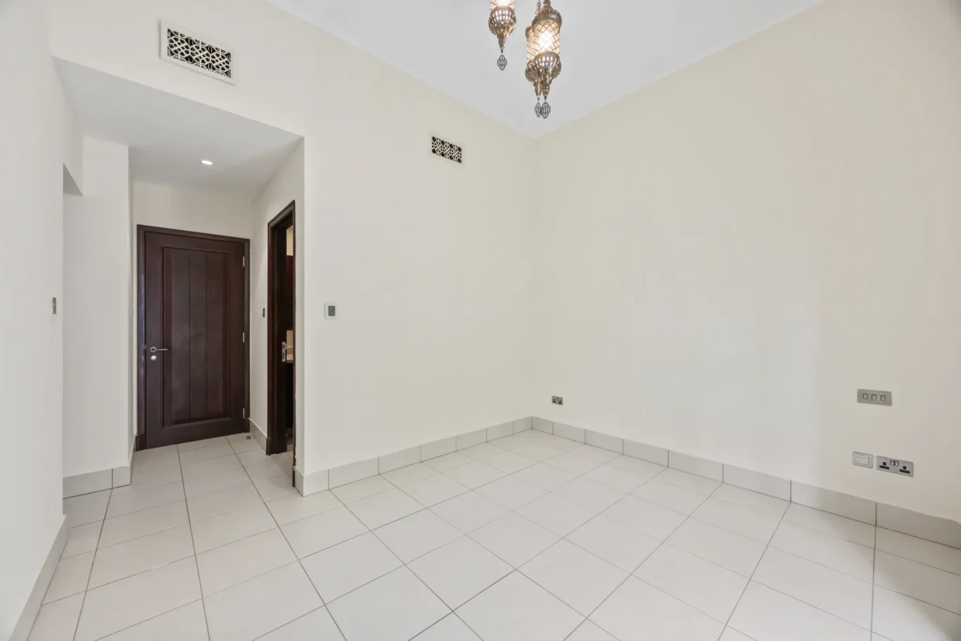 Second bedroom entrance in an unfurnished two-bedroom garden apartment in Old Town, Downtown Dubai, photographed for ELITE Property Brokerage.