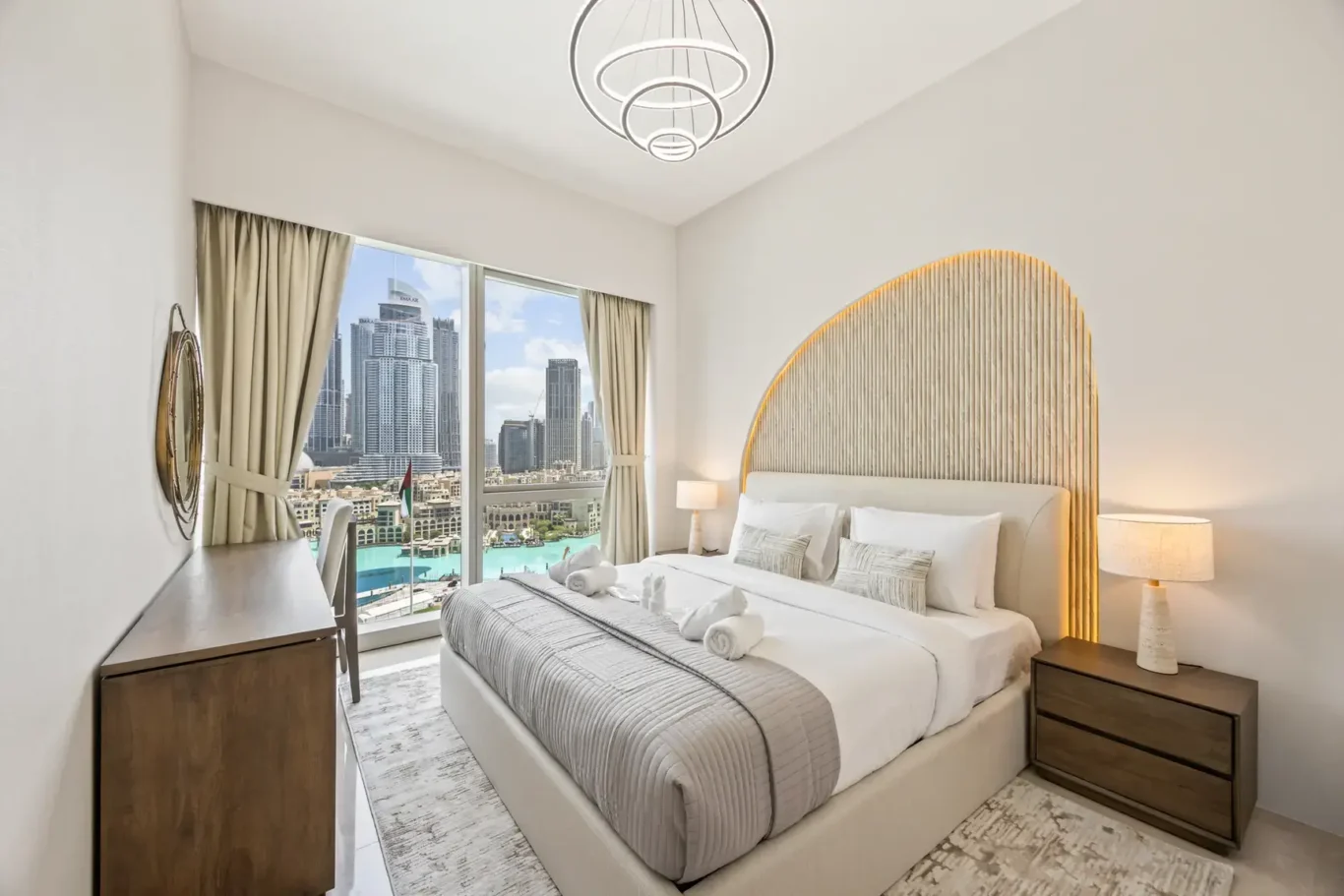 Master bedroom with king bed in a two-bedroom StayComfy Holiday Homes apartment at Grande Signature, Downtown Dubai.