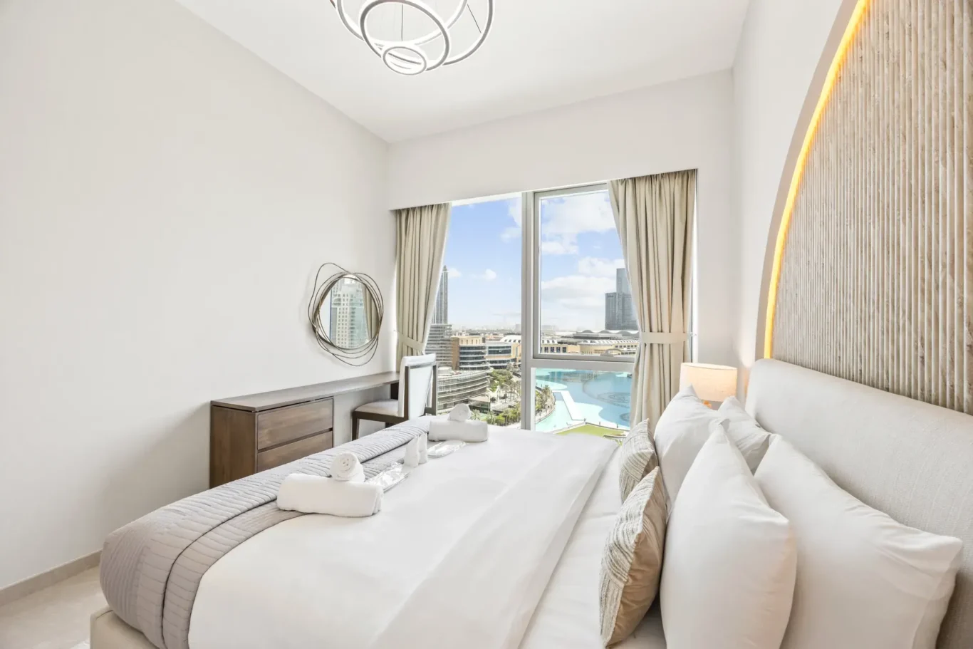 Master bedroom bedside detail in a two-bedroom StayComfy Holiday Homes apartment at Grande Signature, Downtown Dubai.