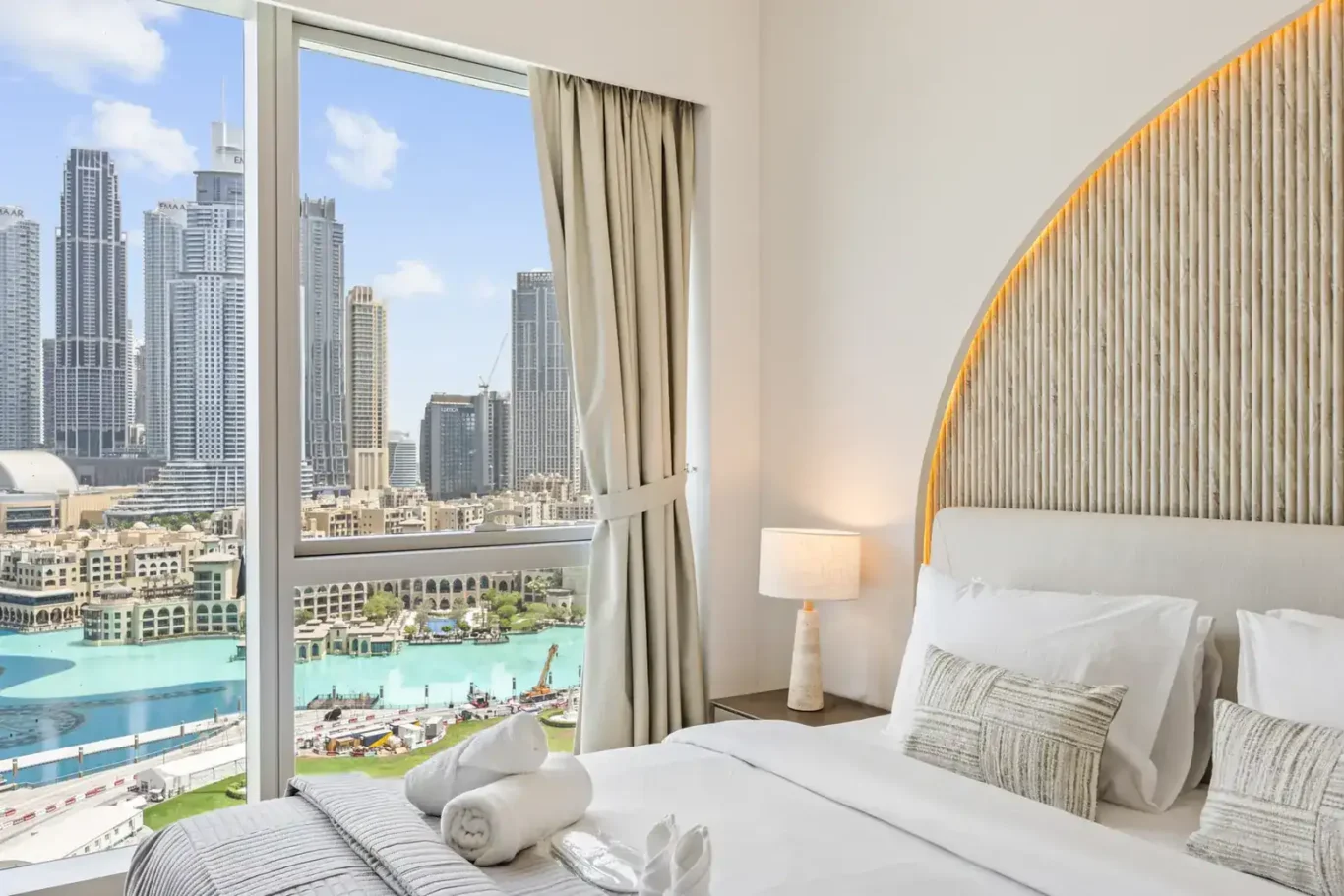 Master bedroom with fountain view in a two-bedroom StayComfy Holiday Homes apartment at Grande Signature, Downtown Dubai.