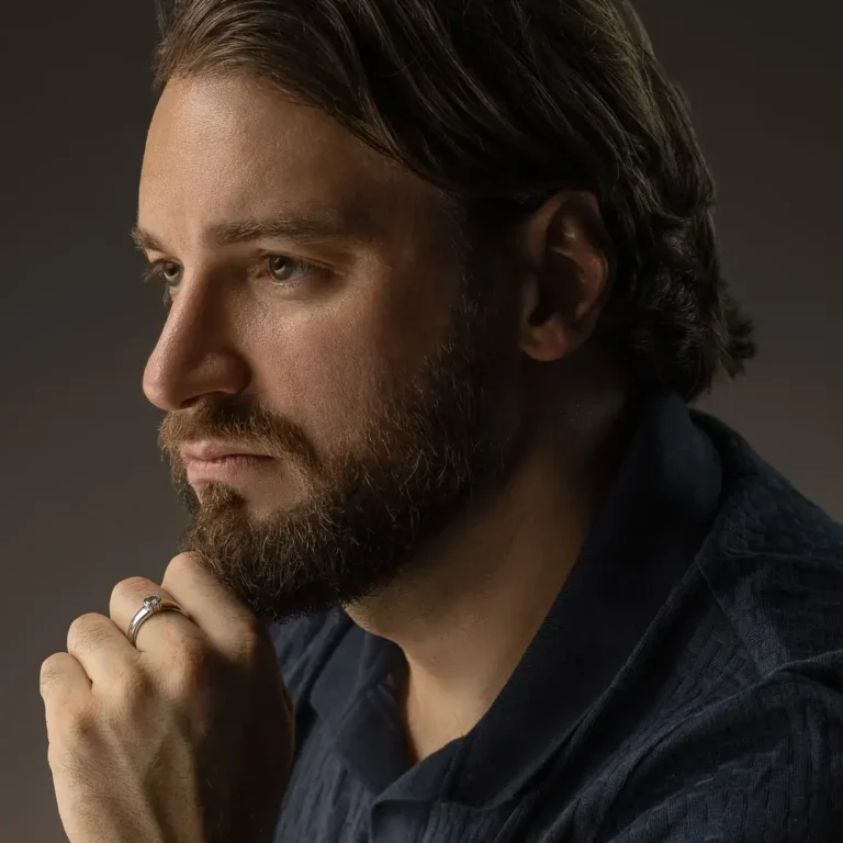 Moody close-up portrait with hand near the chin. Lifestyle portrait from an AI digital twin photoshoot at the MRPS studio in Dubai.