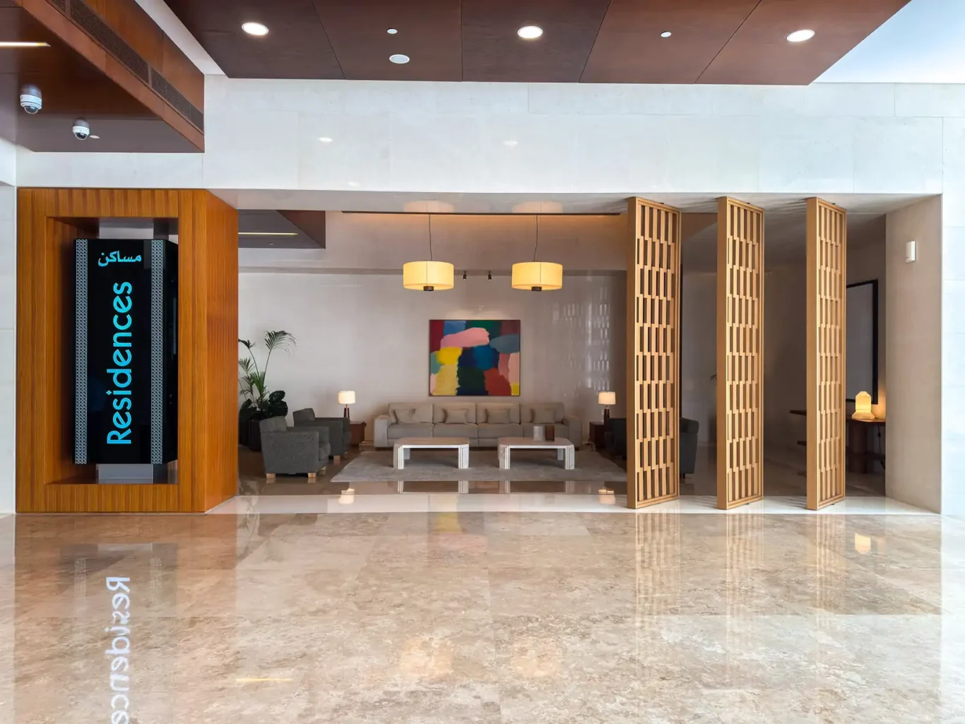 Burj Daman residences lobby with seating at Burj Daman, DIFC, photographed for Your Stay Apartments.