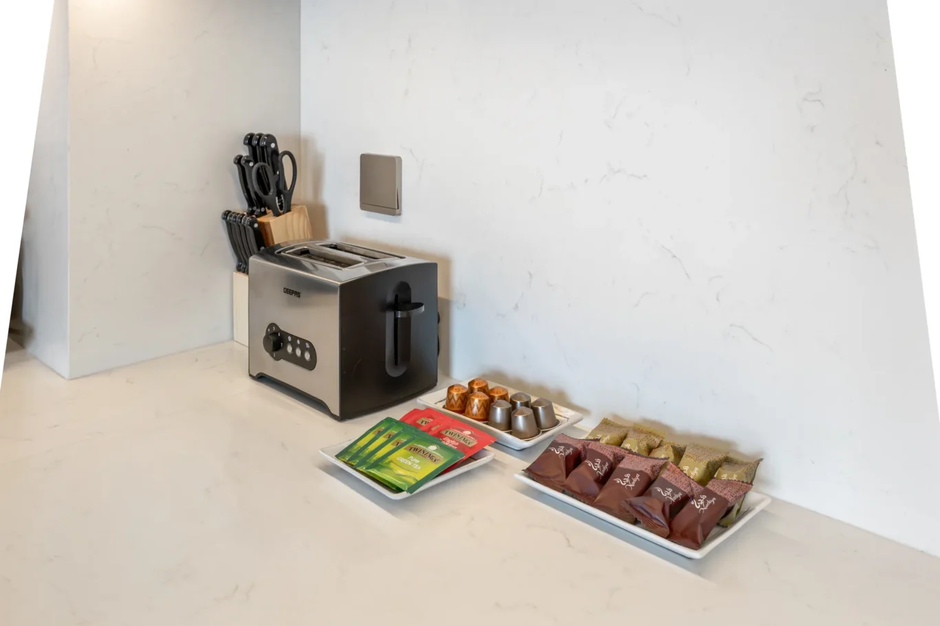 Kitchen worktop breakfast amenities in a two-bedroom StayComfy Holiday Homes apartment at Grande Signature, Downtown Dubai.