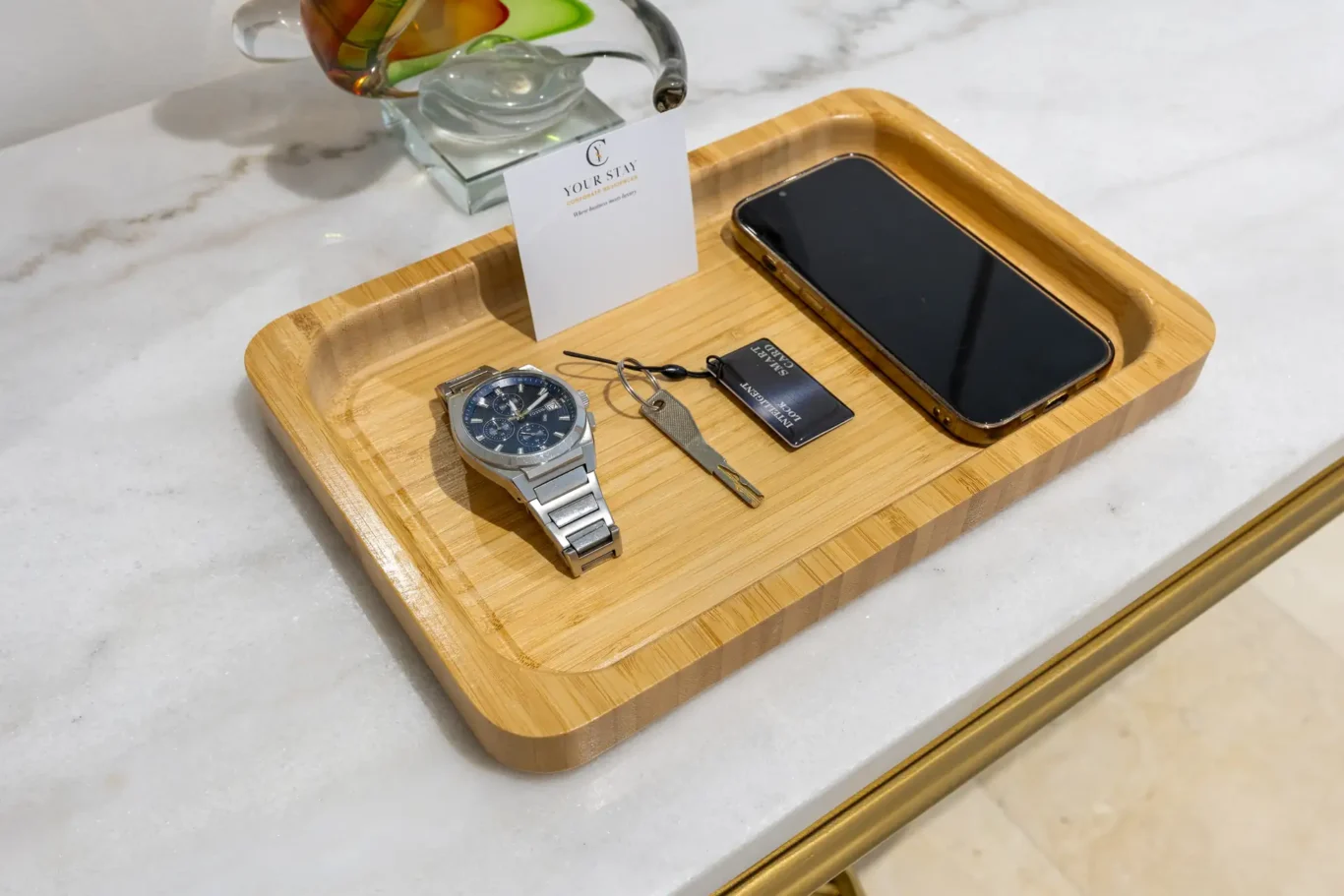 Welcome tray with keys and a guest card in a Your Stay Apartments one-bedroom at Sky Gardens, DIFC, Dubai.