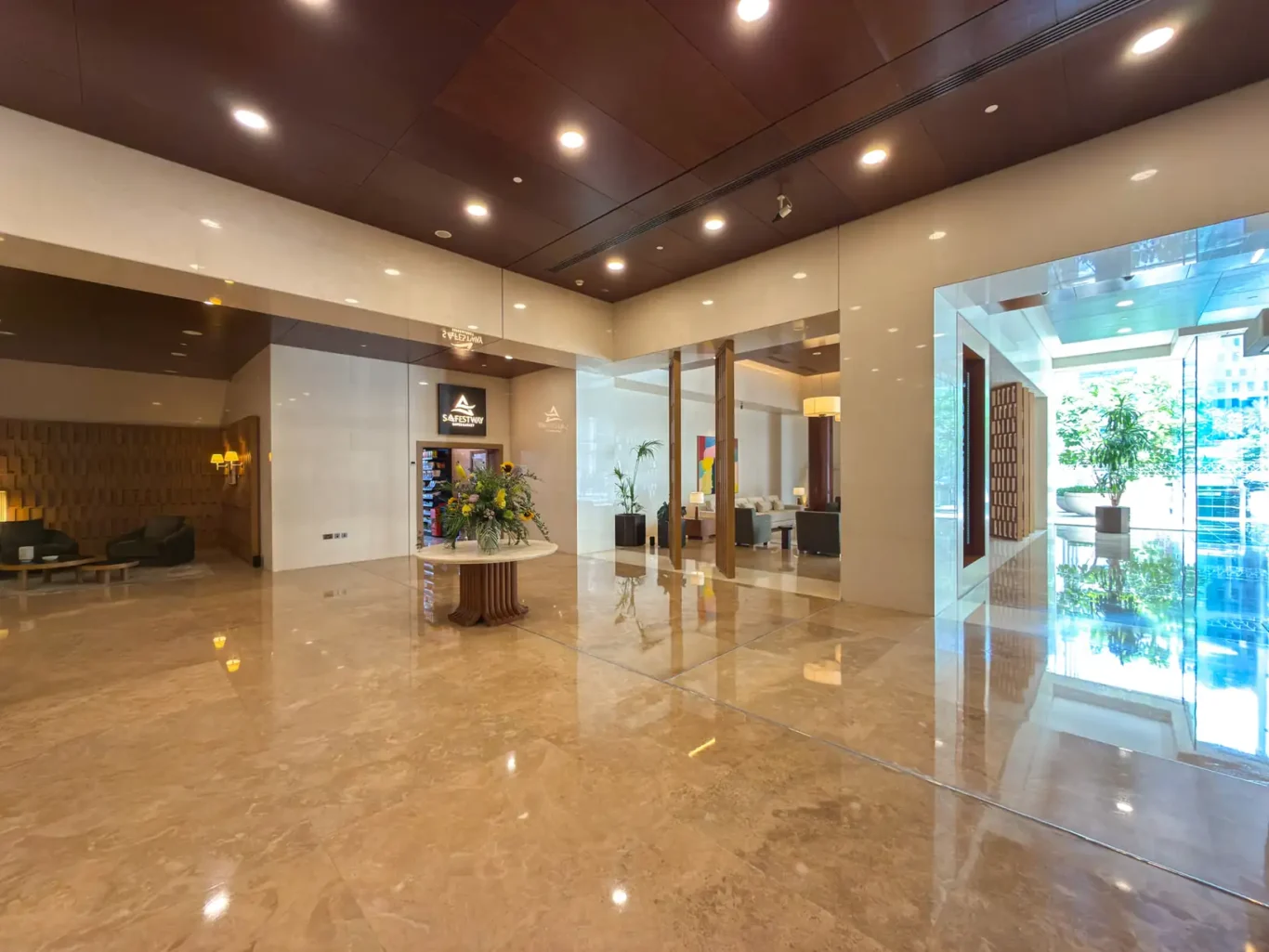 Lobby with marble floor and timber ceiling at Burj Daman, DIFC, photographed for Your Stay Apartments.