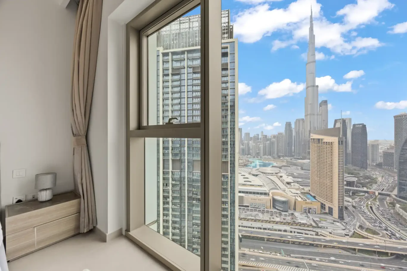 Second bedroom window with the Burj Khalifa in view. Day, twilight and night Airbnb photography by MRPS for Vista Haus Holiday Homes in Downtown Dubai.