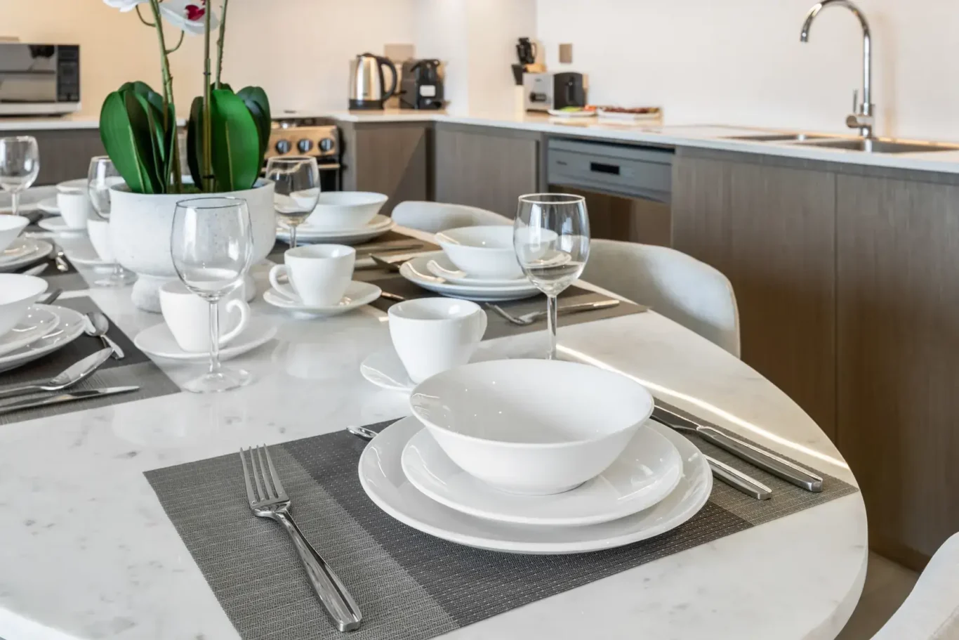 Dining table place setting in a two-bedroom StayComfy Holiday Homes apartment at Grande Signature, Downtown Dubai.