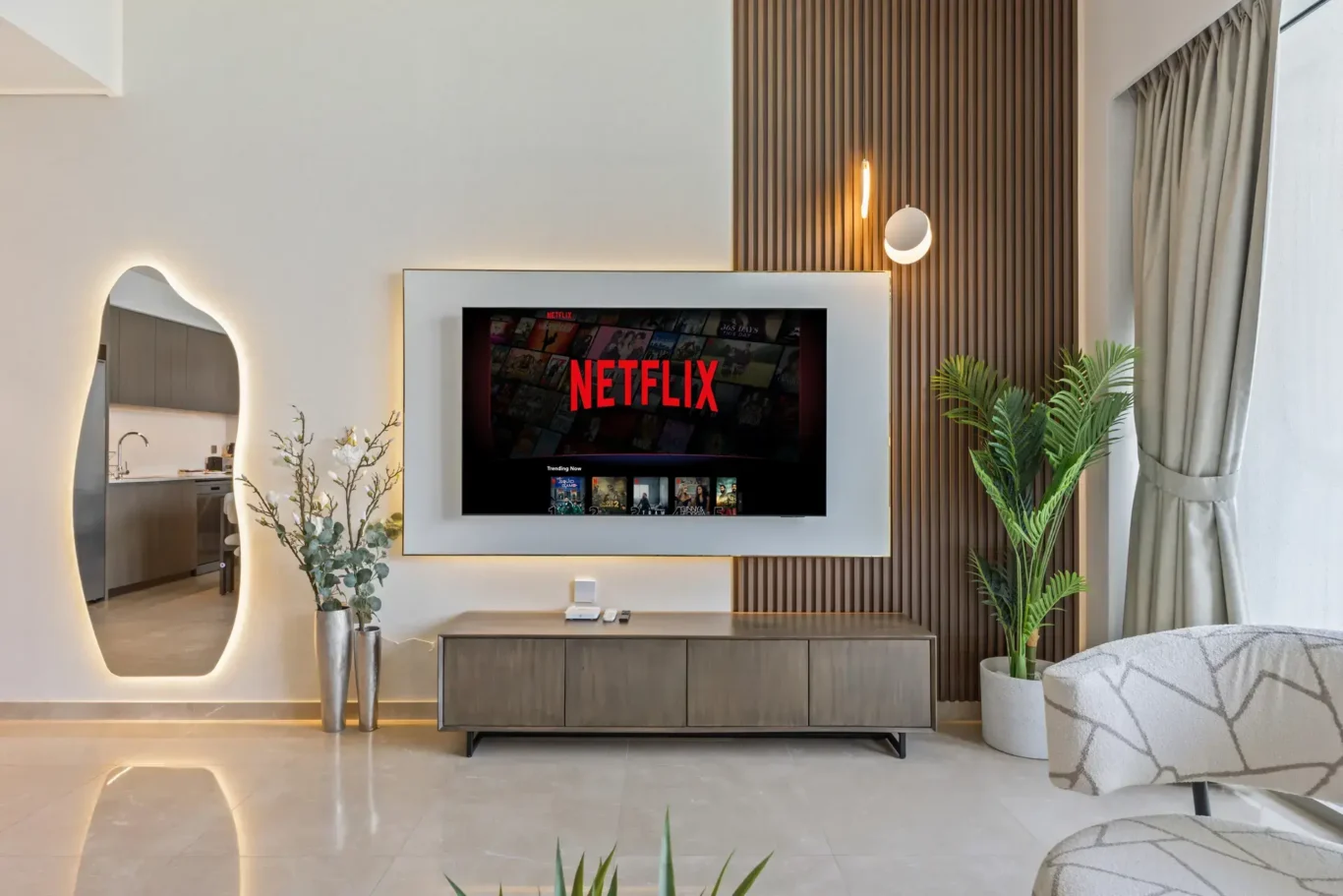 Living room TV feature wall in a two-bedroom StayComfy Holiday Homes apartment at Grande Signature, Downtown Dubai.