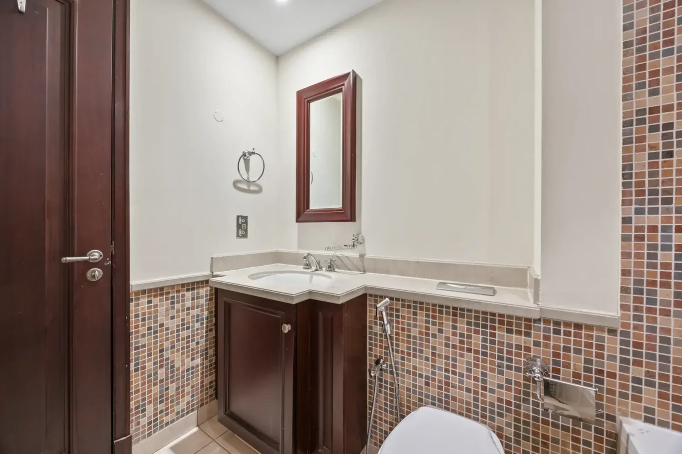 Bathroom vanity and mosaic tiles in an unfurnished two-bedroom garden apartment in Old Town, Downtown Dubai, photographed for ELITE Property Brokerage.