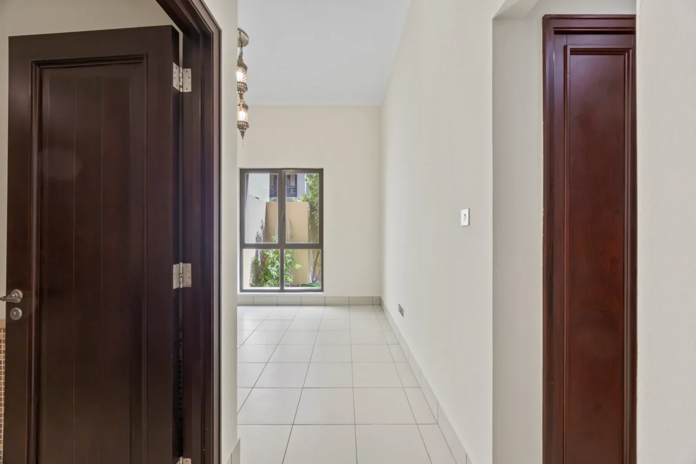 Corridor to the bedrooms in an unfurnished two-bedroom garden apartment in Old Town, Downtown Dubai, photographed for ELITE Property Brokerage.