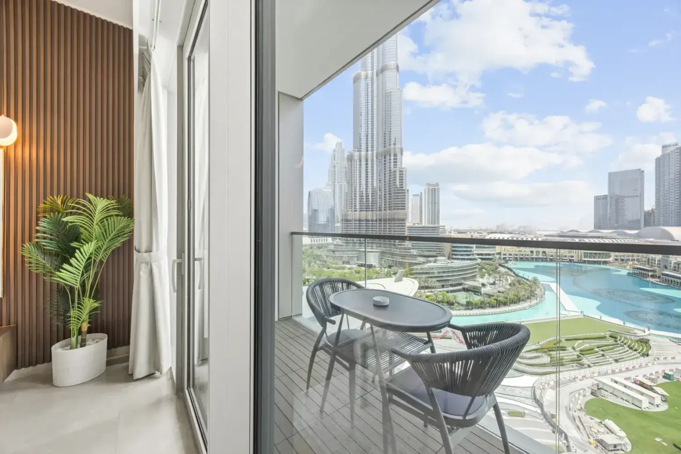 Balcony with Burj Khalifa view in a two-bedroom StayComfy Holiday Homes apartment at Grande Signature, Downtown Dubai.