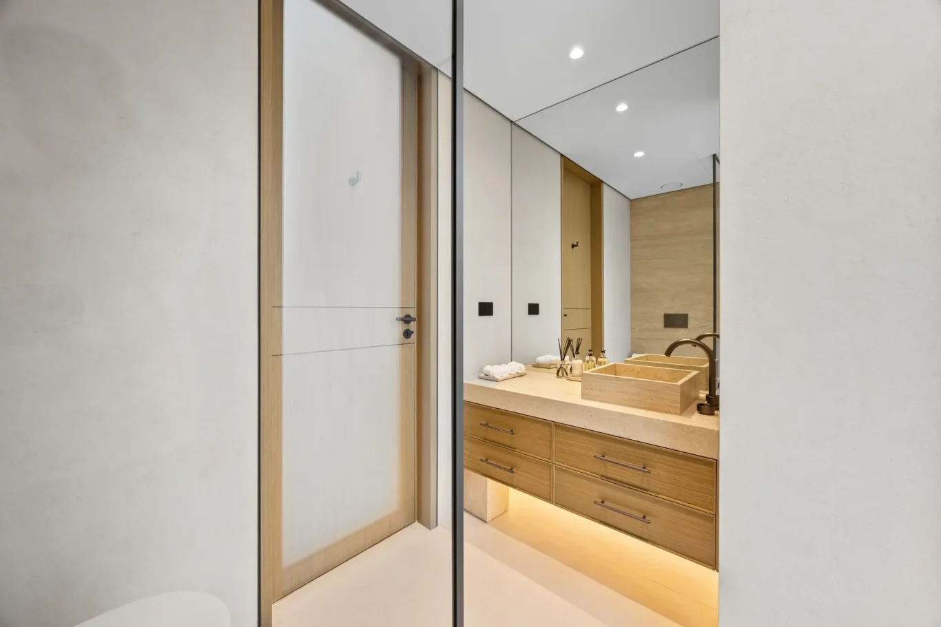 En-suite bathroom vanity with a stone basin, luxury villa in Jumeirah Islands, Dubai.