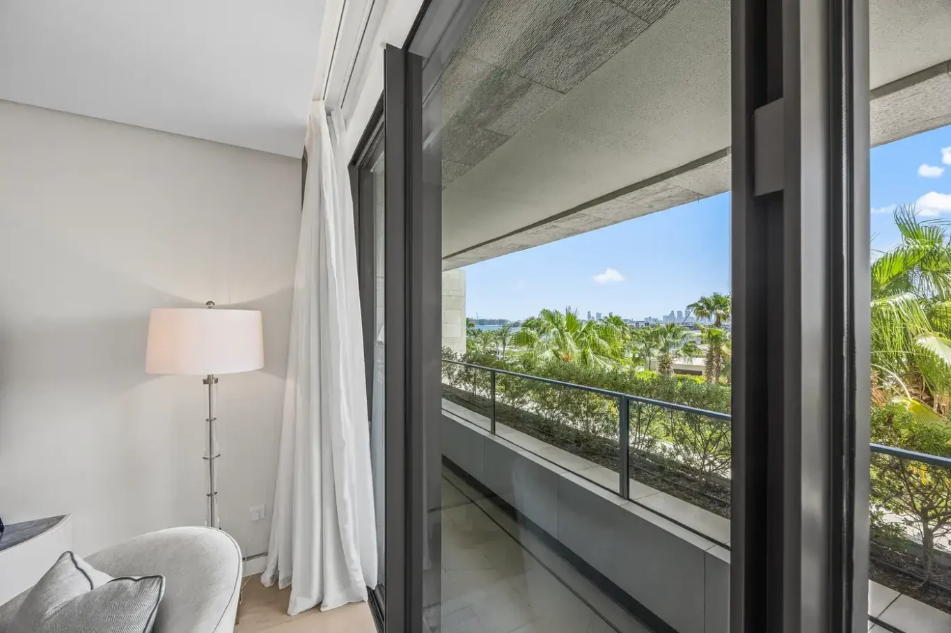 Bedroom window with garden view in a furnished three-bedroom residence at Atlantis The Royal, Palm Jumeirah, photographed for Apex Homes Real Estate.