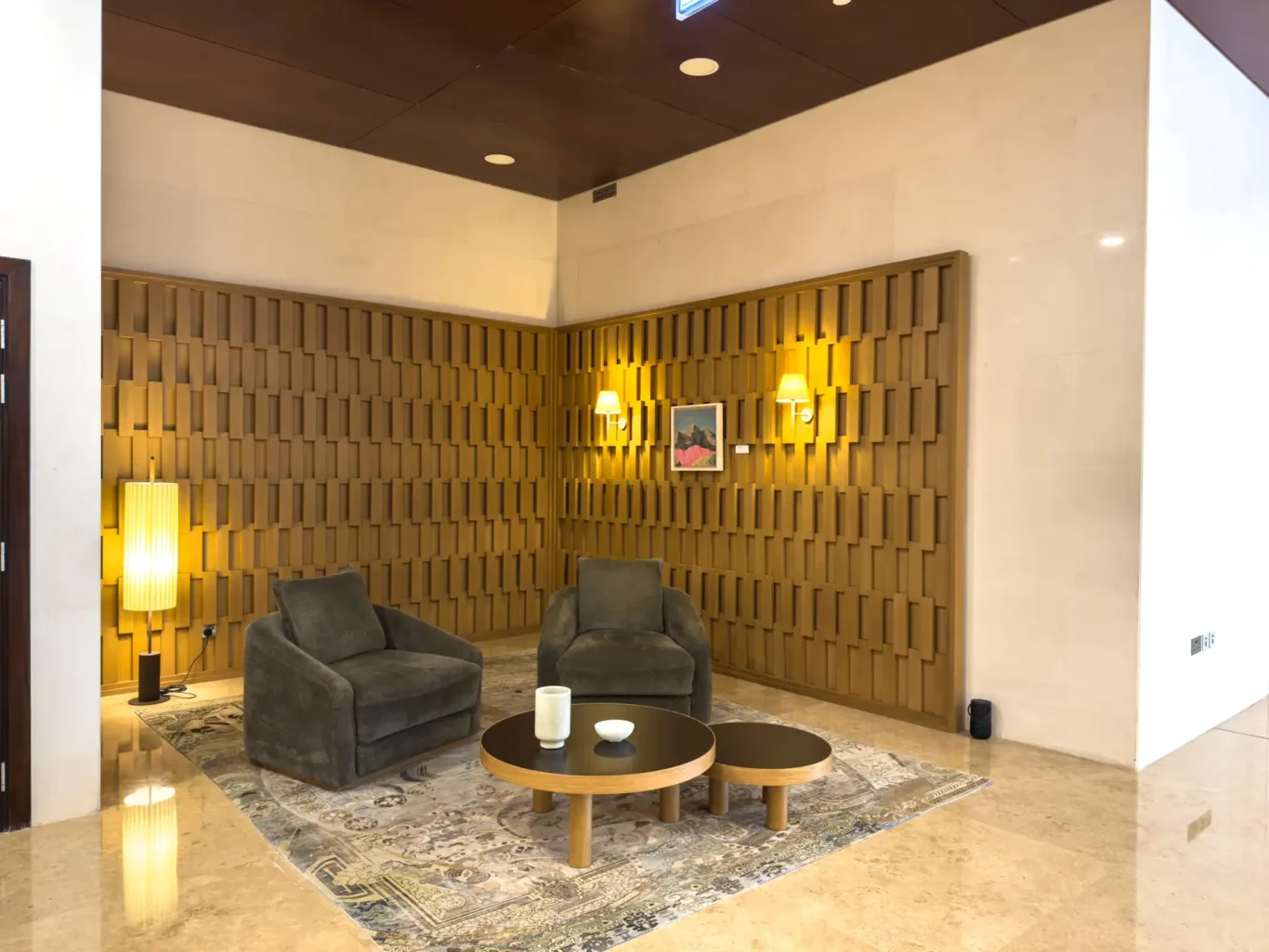 Lounge chairs in the lobby at Burj Daman, DIFC, photographed for Your Stay Apartments.