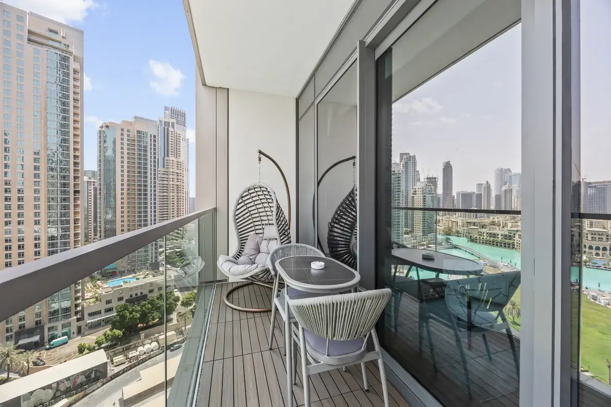 Balcony hanging chair seating in a two-bedroom StayComfy Holiday Homes apartment at Grande Signature, Downtown Dubai.