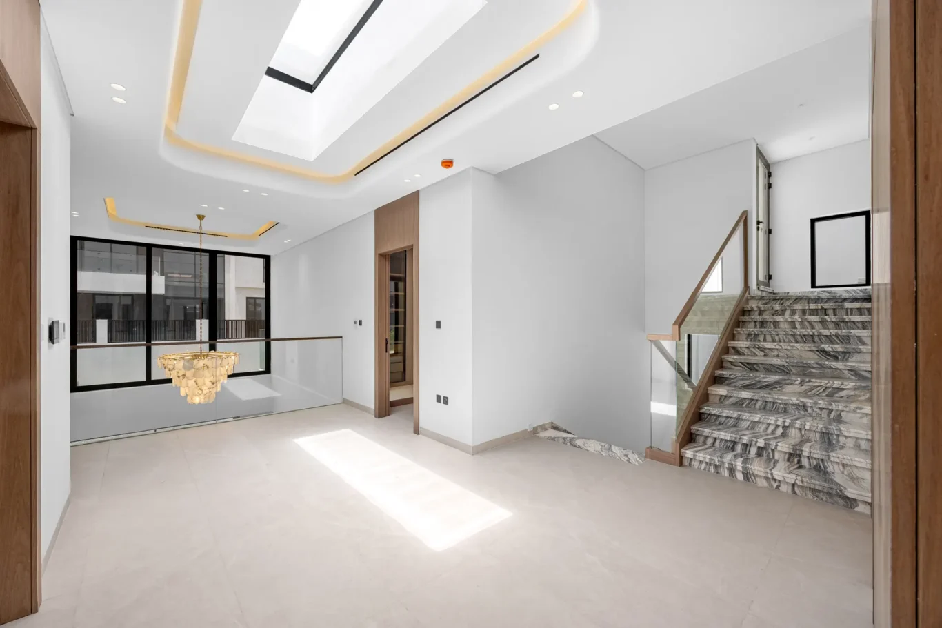 First floor landing with stairs to the roof terrace, unfurnished five-bedroom villa in Al Furjan, Dubai.