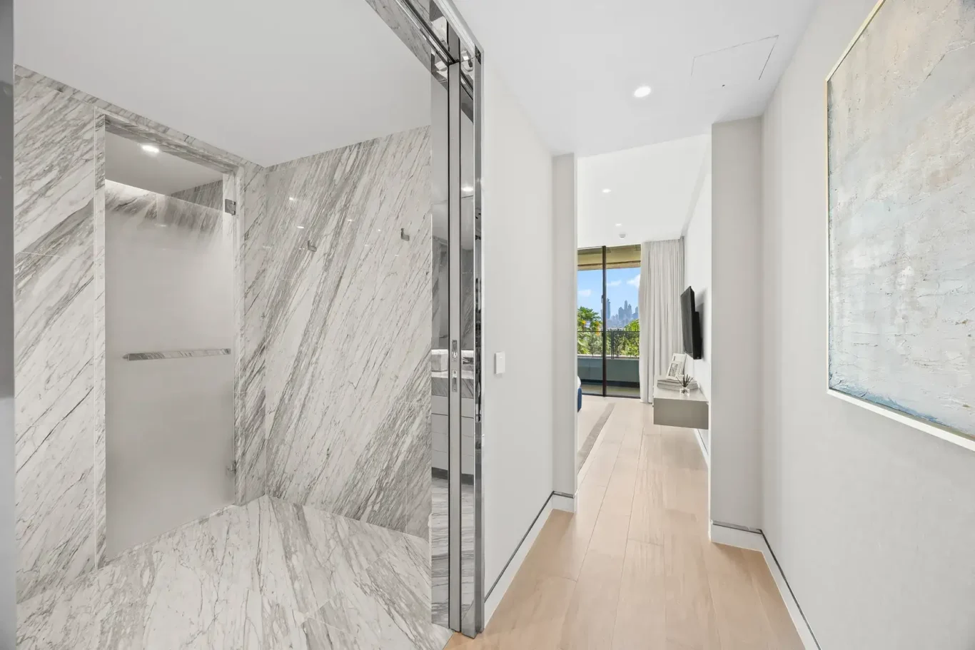 En suite bathroom with marble walk-in shower in a furnished three-bedroom residence at Atlantis The Royal, Palm Jumeirah, photographed for Apex Homes Real Estate.