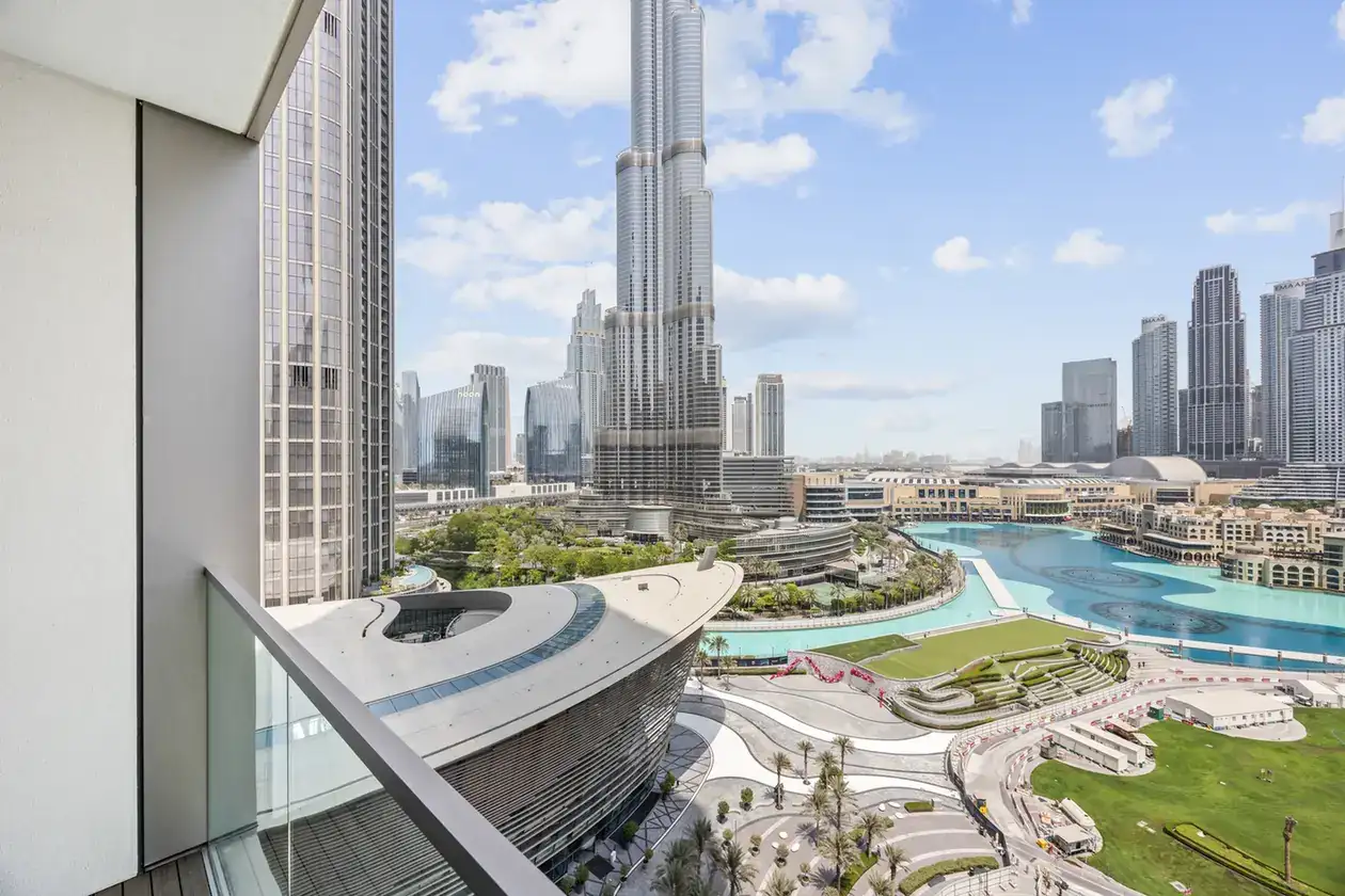 Burj Khalifa and fountain daytime view in a two-bedroom StayComfy Holiday Homes apartment at Grande Signature, Downtown Dubai.