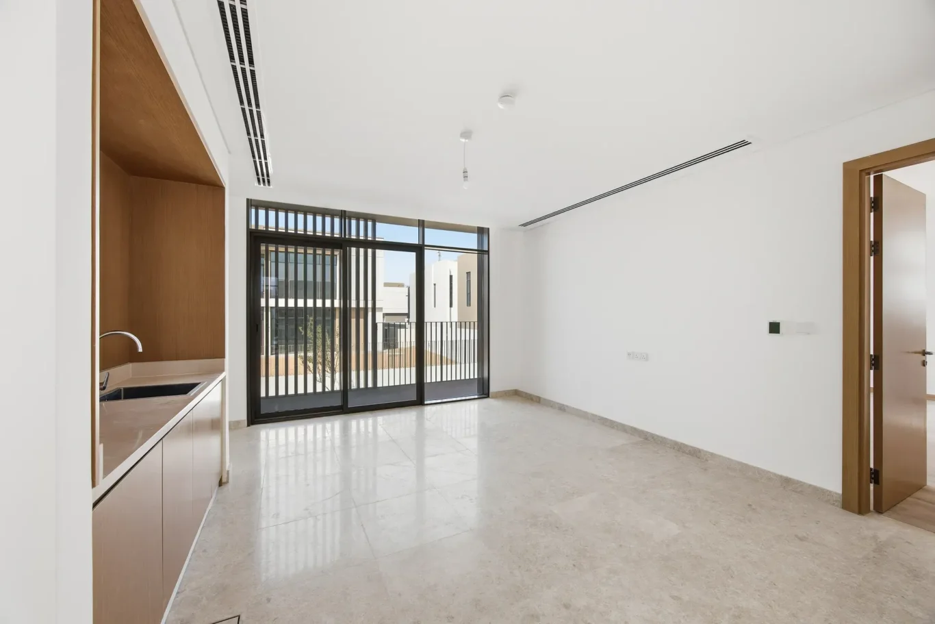 First floor terrace with timber screen and community view. Villa photography by MRPS in Dubai for ELITE Property Brokerage.