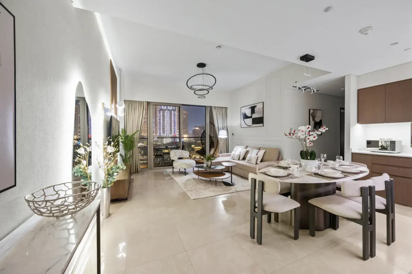 Wide view of living and dining in a two-bedroom StayComfy Holiday Homes apartment at Grande Signature, Downtown Dubai.
