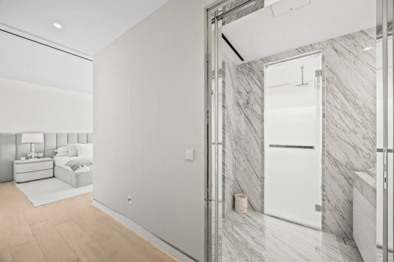 Bathroom entrance with marble shower in a furnished three-bedroom residence at Atlantis The Royal, Palm Jumeirah, photographed for Apex Homes Real Estate.