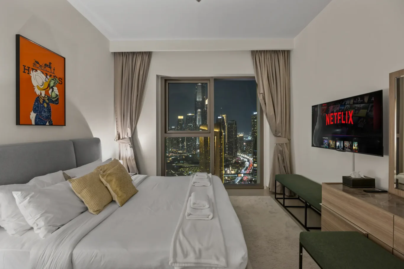Master bedroom with wardrobe and twilight city view. Day, twilight and night Airbnb photography by MRPS for Vista Haus Holiday Homes in Downtown Dubai.