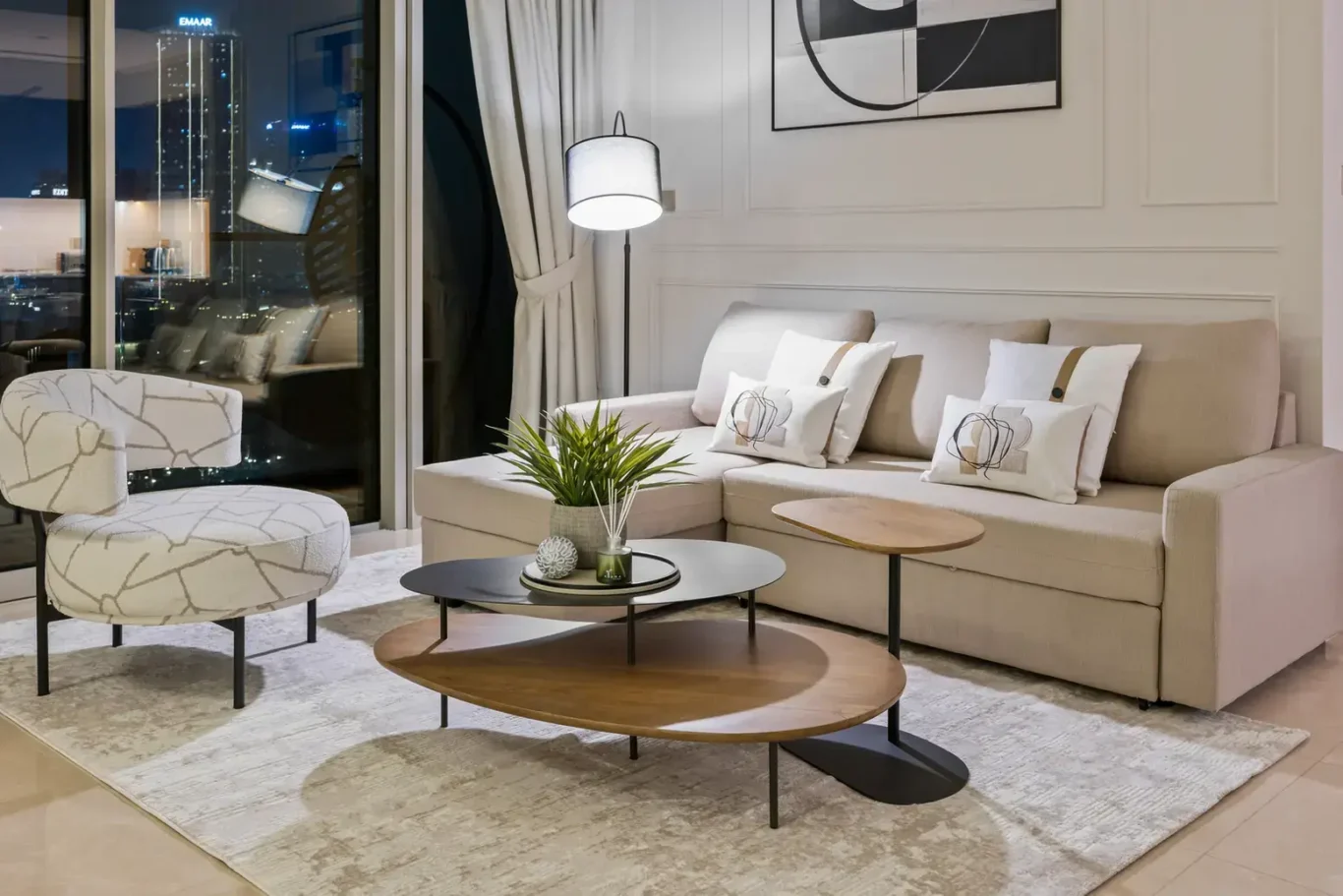Living room lounge at night in a two-bedroom StayComfy Holiday Homes apartment at Grande Signature, Downtown Dubai.