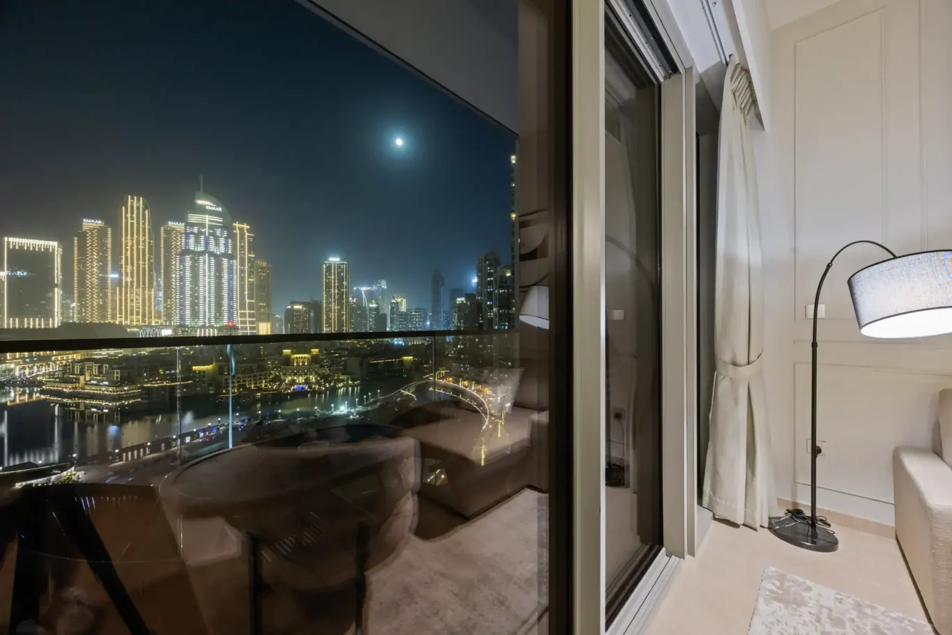 Downtown Dubai night view in a two-bedroom StayComfy Holiday Homes apartment at Grande Signature, Downtown Dubai.