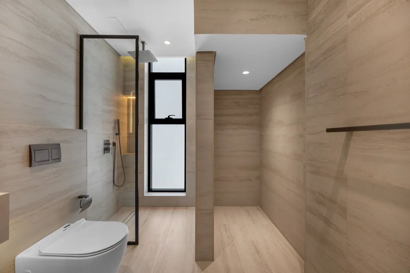 Shower room with wood-effect tiles and black fittings, unfurnished five-bedroom villa in Al Furjan, Dubai.