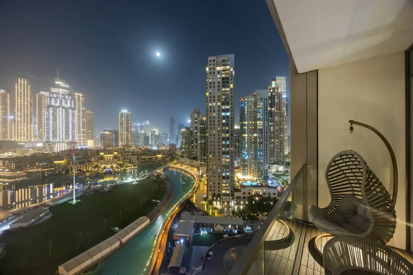 Balcony with Dubai Fountain at night in a two-bedroom StayComfy Holiday Homes apartment at Grande Signature, Downtown Dubai.