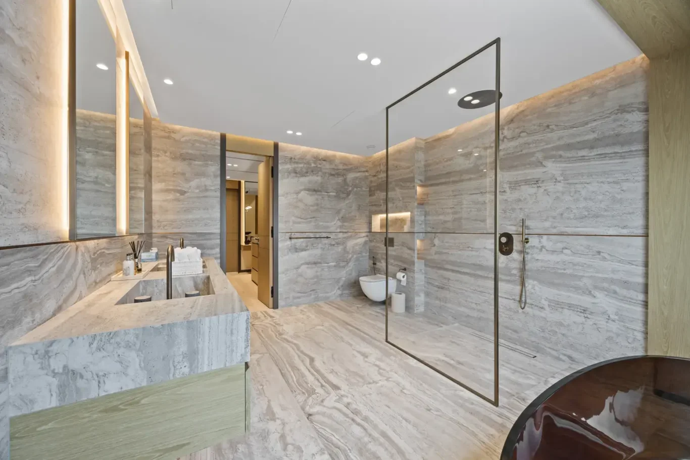 Master bathroom with a walk-in rain shower and double vanity, luxury villa in Jumeirah Islands, Dubai.