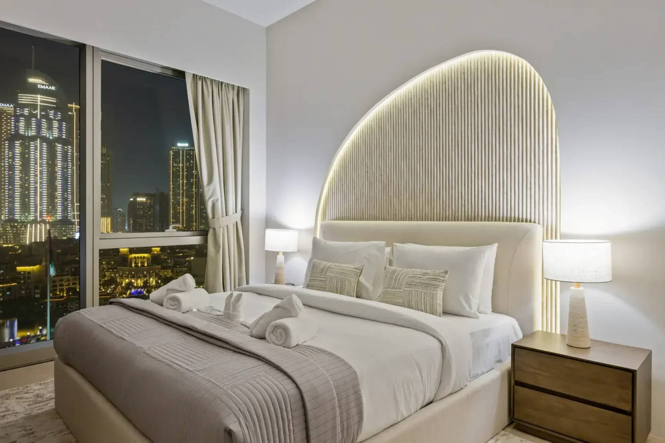 Master bedroom at night in a two-bedroom StayComfy Holiday Homes apartment at Grande Signature, Downtown Dubai.