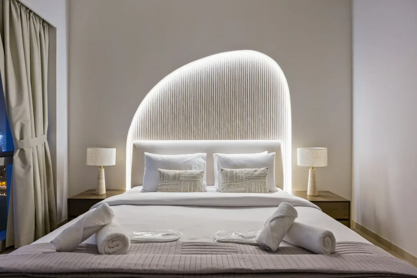 Master bedroom evening lighting in a two-bedroom StayComfy Holiday Homes apartment at Grande Signature, Downtown Dubai.