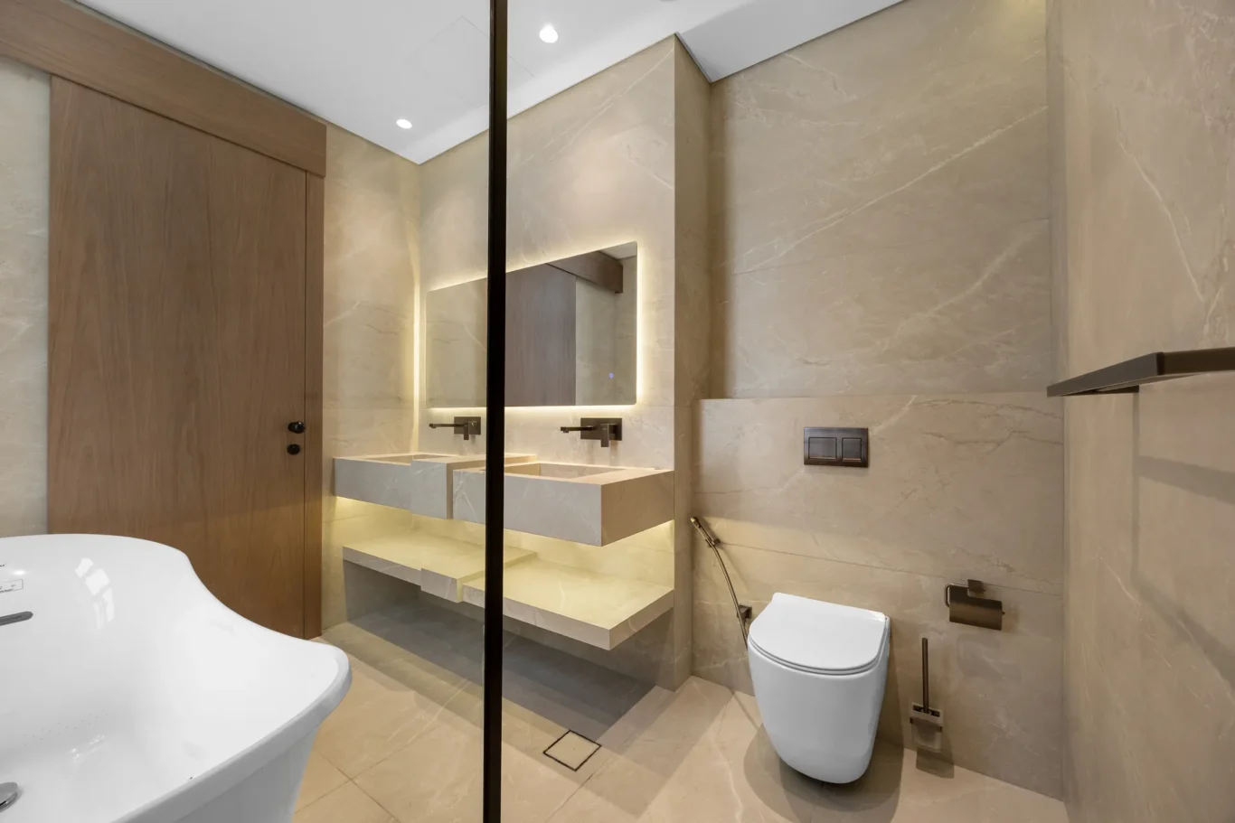 Bathroom with a freestanding bathtub and floating vanity, unfurnished five-bedroom villa in Al Furjan, Dubai.