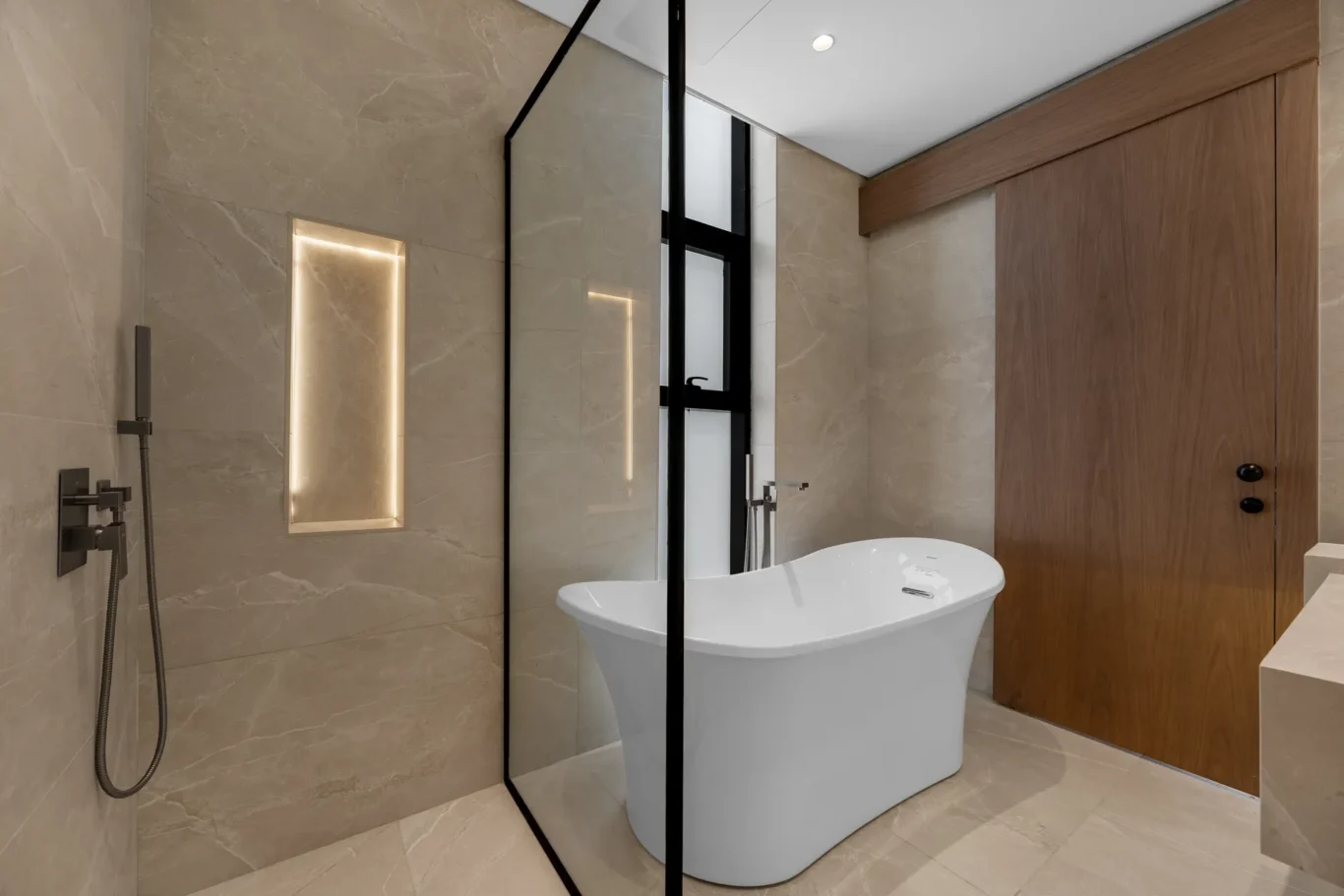 Bathroom with a freestanding tub and walk-in shower, unfurnished five-bedroom villa in Al Furjan, Dubai.