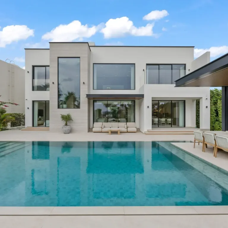 Rear exterior with the swimming pool and outdoor dining pergola, luxury villa in Jumeirah Islands, Dubai.