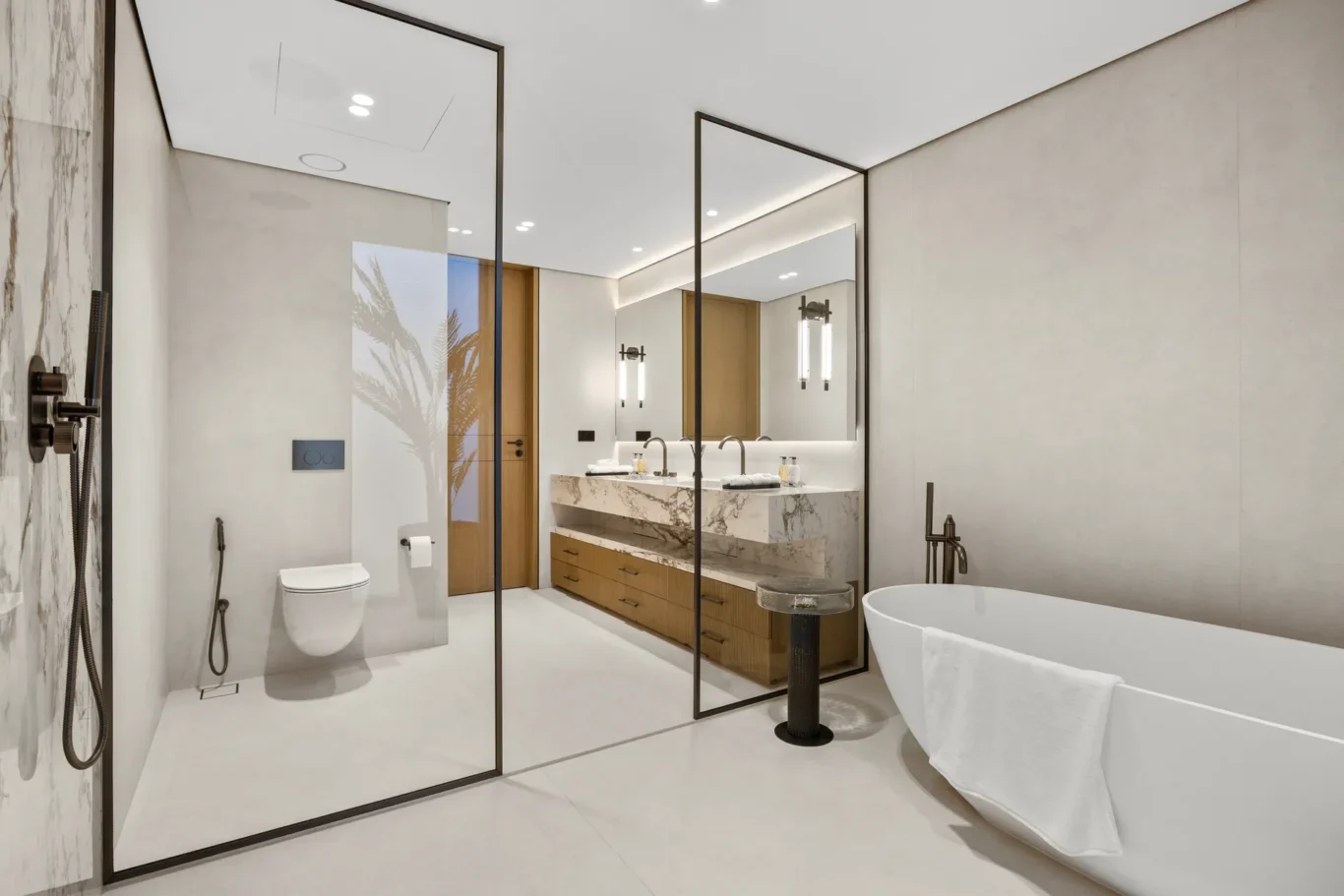 Master bathroom glass shower and freestanding bathtub, luxury villa in Jumeirah Islands, Dubai.