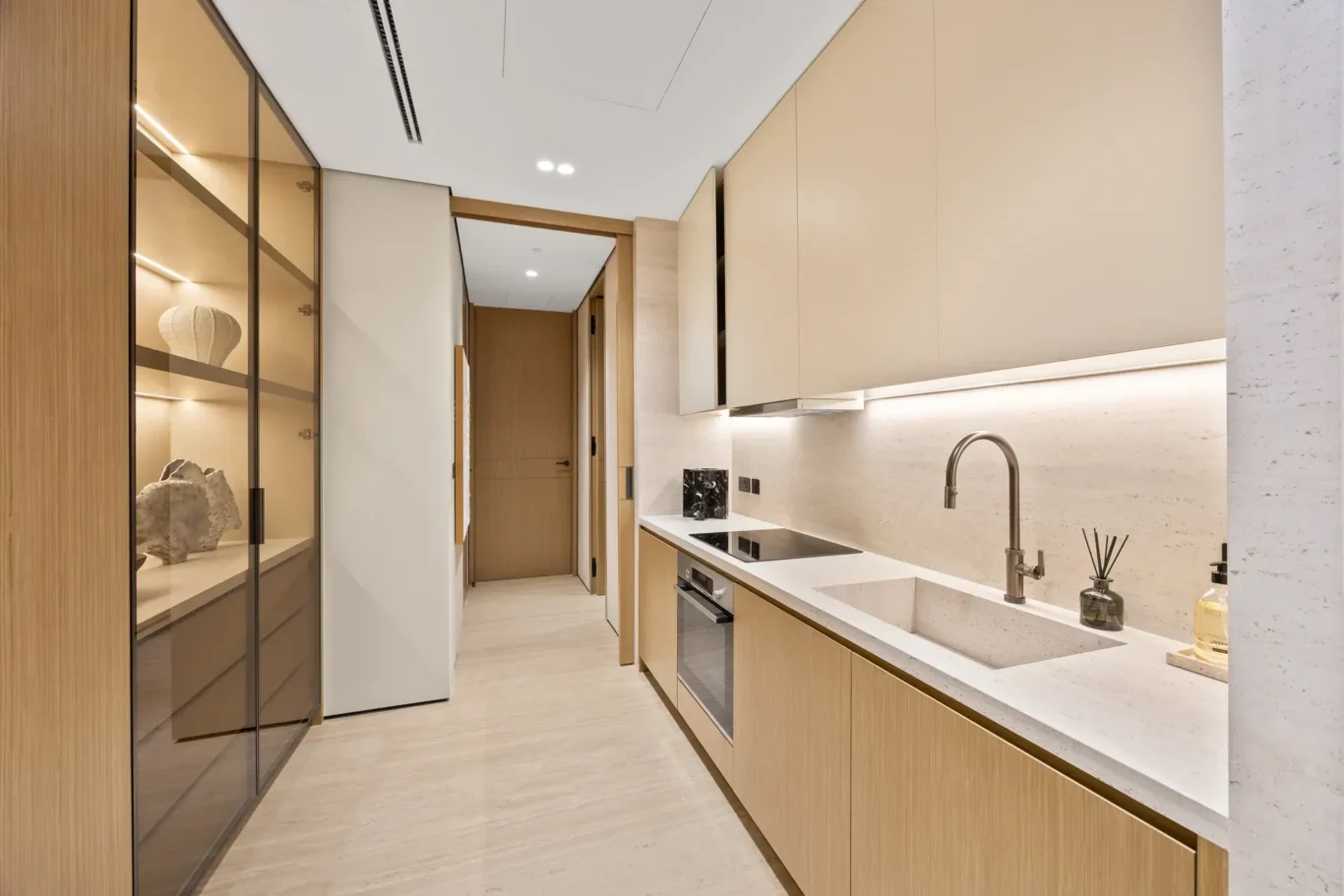 Service kitchen counter with a sink and hob, luxury villa in Jumeirah Islands, Dubai.