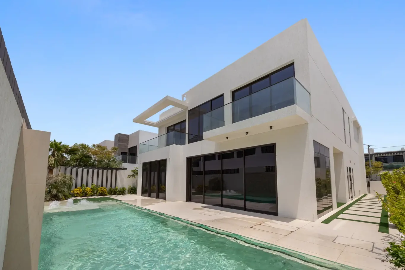 Rear exterior of the villa with the swimming pool, unfurnished five-bedroom villa in Al Furjan, Dubai.