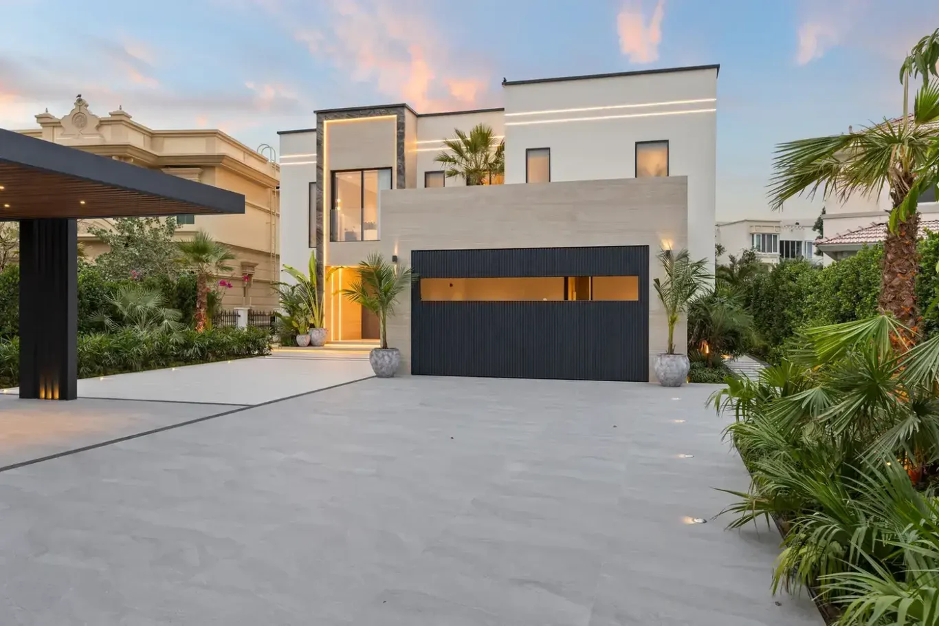 Front exterior and garage at sunset, luxury villa in Jumeirah Islands, Dubai.